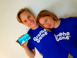 Jesper Ryynänen & Petra Raivonen wearing GraphoGame T-Shirts